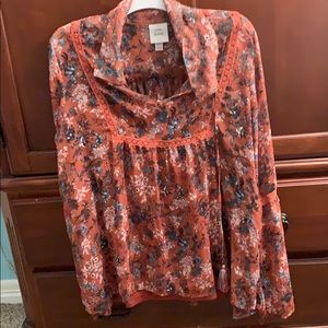 Orange long sleeve blouse with floral pattern